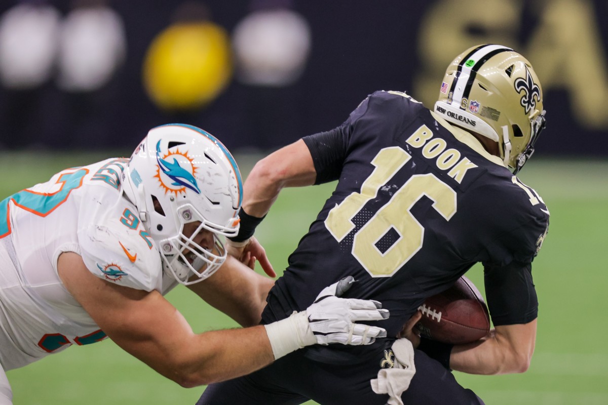 Miami defensive end Zach Sieler (92) sacks New Orleans Saints quarterback Ian Book (16). Mandatory Credit: Stephen Lew-USA TODAY Sports